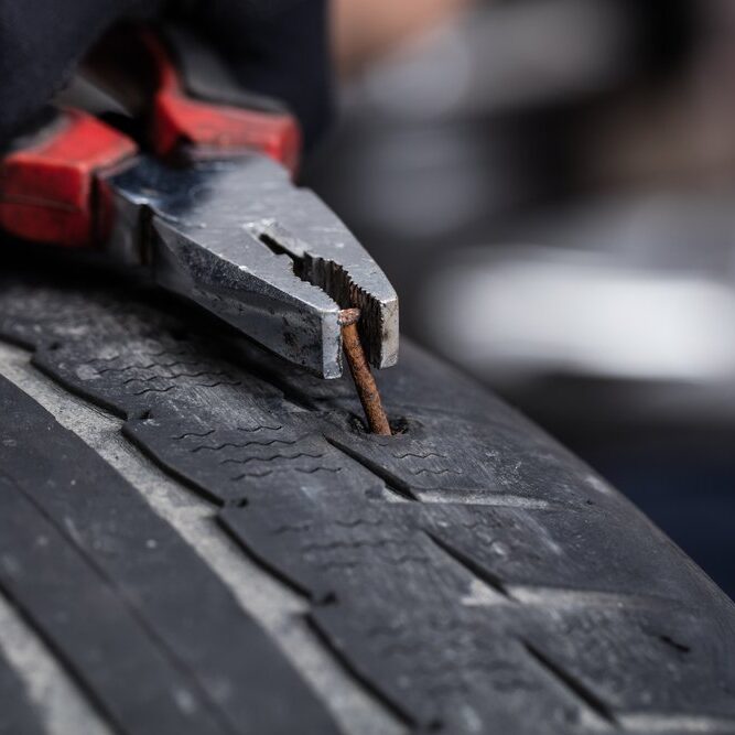 Tyre Repair Tyre being fixed and puncture being repaired