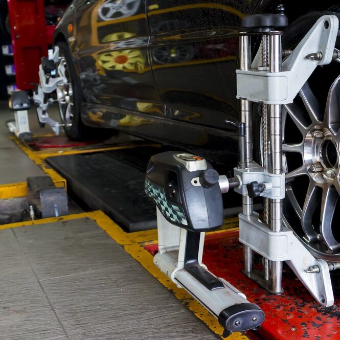 Wheel Alignment Wheel Alignment, Tyre's being aligned
